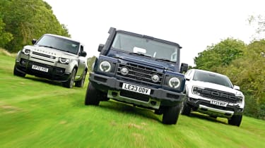 Land Rover Defender, Ineos Grenadier and Ford Ranger Raptor - front action